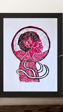 Dark modern picture frame on a shelf with plants